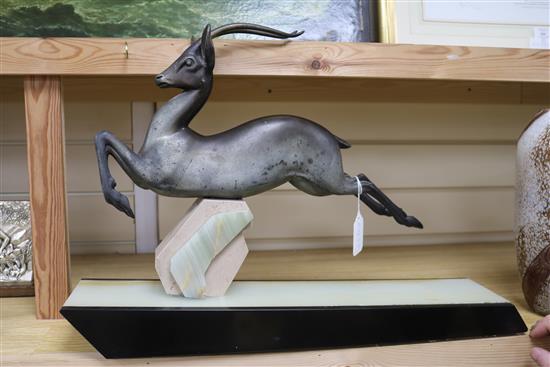 I. Rochard. An Art Deco bronze figure of an antelope, on marble base, signed length 56cm
